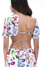 Robe mi-longue en coton à découpes